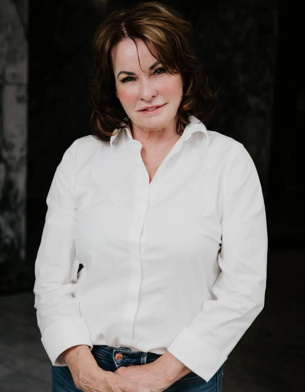 Professional portrait of Kathleen Mason-Morton, PA-C in white blouse – Med Spa Edmond OK Confident portrait of Kathleen Mason-Morton, PA-C wearing a white blouse and smiling warmly, representing expertise and leadership – Med Spa Edmond OK